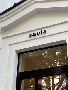 there is a sign that says paula above the door