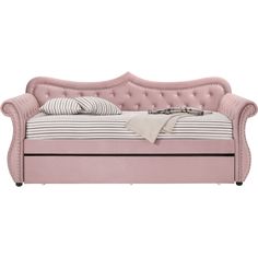 a pink daybed with pillows on it and a striped pillow in the bed frame