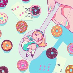 a person holding a spoon with donuts on it