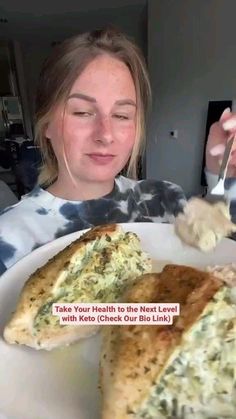 a woman is eating some food on a plate