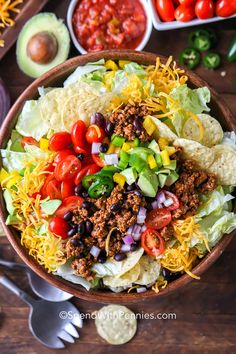 a bowl filled with taco salad and tortilla chips