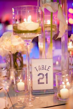 a table with candles and flowers on it