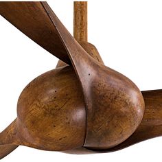 a close up of a wooden object with two large blades on it's back