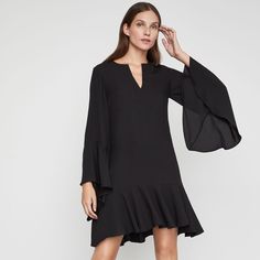 This Flowing Shift Dress In Satin-Back Crepe Features Long Flutter Sleeves, A Split V-Neckline, And A Flounced Hem. Pullover Fabric Self: 100% Polyester Satin-Back Crepe Machine Wash Imported A Size Small Measures Approximately 36.25" From Shoulder To Hem Midweight, Non-Stretch Fabric Above-The-Knee Hemline Easy Fit Model Is Approximately 5'9” (175cm) And Is Wearing An Xs Bcbg Small Is A Size 6 Shift Dress Black, Bcbgmaxazria Dresses, Polyester Satin, Flutter Sleeves, Above The Knee, Flutter Sleeve, Shift Dress, Dress Black, New Color