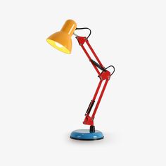 a red and yellow desk lamp on a white background with the light turned on to its side