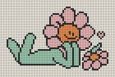 a cross stitch pattern with an image of a woman laying on her stomach and holding flowers