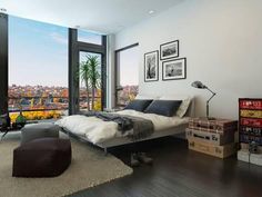 a bedroom with a large window overlooking the city