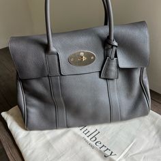 Iconic Bayswater Style Handbag Made By Mulberry (Medium Grey Pebbled Leather). Retails $1650 Color No Longer Available On Their Website. Kept In Excellent Pre-Loved Condition- No Scuffs, Marks On Leather, Or Discoloration To Hardware. Used For A Short While And Ended Up Purchasing A Different Silhouette & Wasn’t Able To Return. Great Size! Classic Style! Please Let Me Know If Any Questions Or Would Like Additional Photos! Please Note: Screenshots From Website Are Not Accurate In Color And Were S Mini Bayswater Mulberry, Mulberry Small Iris Bag, Pink Mulberry Bag, Mulberry Tote Bag, Mulberry Bayswater, Mulberry Bag, How To Make Handbags, Pebbled Leather, Classic Style