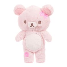 a pink teddy bear with flowers on its ears