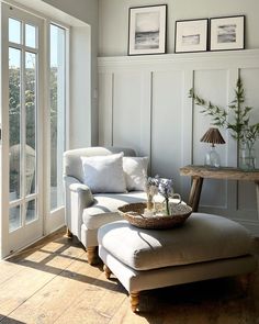 a living room filled with furniture and windows