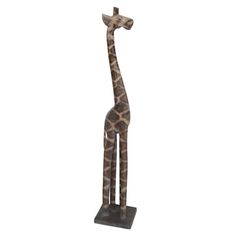 a statue of a giraffe is shown against a white background