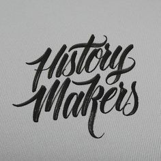 the words history makers written in black ink