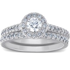 a diamond ring with two rows of diamonds on the band and an oval shaped center stone