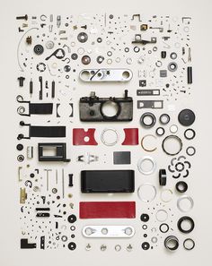 an assortment of different parts are arranged on a white surface