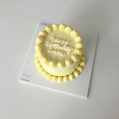 a happy birthday cake on a white table