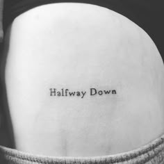 a woman's lower back with the words halfway down on it