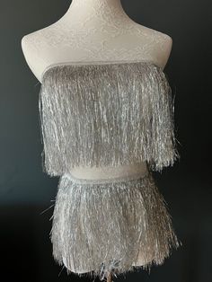 Fantastic 8" fringe with a 1cm tape for sewing. Very High quality.  Colour: Silver  Perfect for dresses, tops, dance costumes, party wear, crafting.  Available in 15 Colours.  see separate listings for colour photos.  Price Per metre (100cm / 39inches) Visit www.haberdasheryfan.com for our full range with free shipping. More unique pieces added daily! Follow us on instagram @haberdasheryfan Silver Dance Costume, Fringe Clothing, Fringe Fabric, Gatsby Dress, Party Kleidung, Dance Bag, Fringe Skirt, Suede Fringe, Silver Accessories