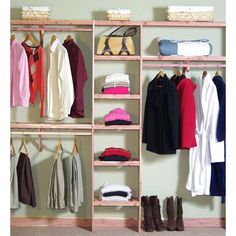 an organized closet with clothes and shoes