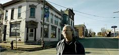 a man standing on the side of a street