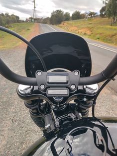 the handlebars and gauges on a motorcycle are clearly visible for all to see