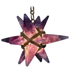 a star shaped pendant with purple crystals hanging from it's side