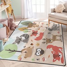 a child's rug with various animals on it in a living room next to a chair