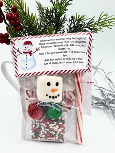 a christmas treat bag filled with marshmallows and candy