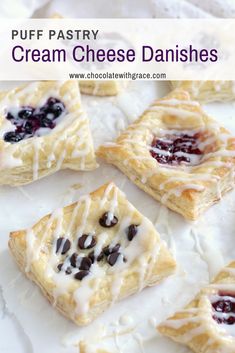 puff pastry cream cheese danishes with blueberries on top and chocolate chips in the middle