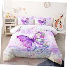 a bed with purple butterflies and flowers on the comforter, next to a white nightstand