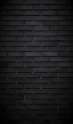 a black brick wall that is very dark