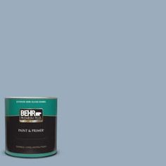 a can of behr paint and primer in one on a blue background with the words behr