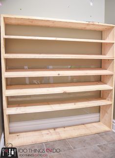 an unfinished bookcase in the corner of a room