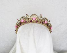 VALENTINE GOLD AND PINK HEART FILIGREE CROWN Brass findings are handstitched to a crown base Painted Gold Embellished with glass gemstones and plastic beads Comfortable and flexible Fits all head sizes from children to adults. ---- One size fits all - bobby pins can easily be used for added securing Wire Crown, Beaded Crown, Heart Crown, Pink Crown, Headpiece Jewelry, Soul Mates, Gold And Pink, Princess Aesthetic, Angel Art