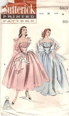 two women in dresses, one is wearing a dress