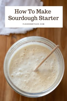 a close up of a drink on a table with the words how to make sourdough starter