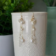 Elegant and sparkly dangle earrings with swarovski crystals and natural pearls. ❀ELEMENTS❀-14k Gold Filled Earring Hooks (Rubber safety backs included)-14k Gold Filled Wire and chain-Swarovski crystal bicone beads-Natural pearls in different shapes and sizes❀SIZE❀Approximately 3 inches long from top of ear wire to bottom of longest dangle❀PRODUCTION❀All of my earrings are handmade in small batches and each one is unique. Gemstones and pearls are natural and may vary in color, pattern, shape, and Pearl And Crystal Earrings, Elegant Dangle Earrings, Handmade Crystal Earrings, Business Jewelry, Earrings Handmade Boho, Pearl Earrings Handmade, Jump Ring Jewelry, Wire Craft, Unique Handmade Earrings