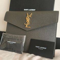 Brand New Full Inclusion Dimensions : 5".9h 7".9w 0".6 D Envelope Flap Top With Tonal Ysl Logo Gold Hardware. "Uptown": Made In Italy Grain De Poudre Leather Green Ysl Pouch Small Ysl Pouch, Bags Ysl, Saint Laurent Bags, Yves Saint Laurent Bags, Ysl Logo, Small Pouch, Saint Laurent Paris, Small Pouches, 6 D