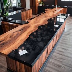 a black counter top sitting in the middle of a room