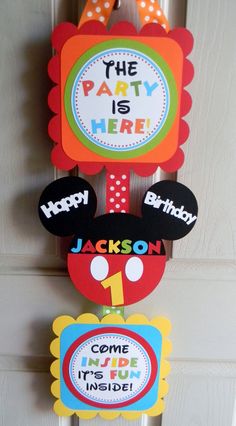 a mickey mouse birthday decoration hanging on the door