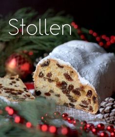 a close up of a piece of cake on a plate with christmas decorations in the background