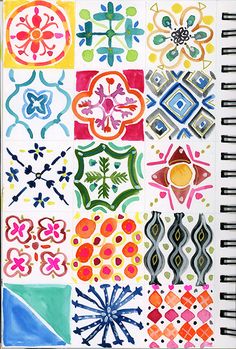 a notebook with different colored designs on it