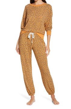 These soft brushed-jersey pajamas will not have to invite you twice to enjoy their luxe, lounge-all-day comfort. 22" top length; 28" inseam; 11" leg opening; 10" front rise; 13" back rise (size medium) Top has boat neck; long sleeves Pants have elastic/drawstring waist 62% polyester, 34% rayon, 4% spandex Machine wash, dry flat Imported Lingerie Printed Pajama, Print Pajamas, Elastic Waist Pants, Pajama Set Women, Honeydew, Sleepwear Women, Boat Neck, Pumpkin Spice, Drawstring Waist