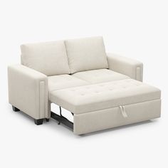 a white couch with a pull out bed underneath it