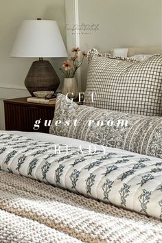 an image of a bed with pillows and blankets