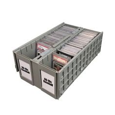 a large plastic container filled with lots of cards and cds on top of each other