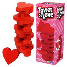 the tower of love game is in front of a cardboard box and it's red