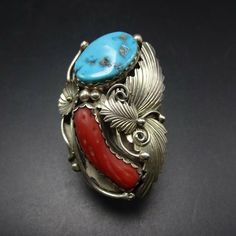 "VINTAGE NAVAJO RING DESCRIPTION: This spectacular ring features Sleeping Beauty turquoise and old red Mediterranean branch coral. The gemstones are secure in scalloped bezel, on a foundation of heavy gauge vintage sterling silver. Highly detailed applied leaves enhance the face of the ring. This impressive ring will be a treasured addition to your collection of fine vintage Native American jewelry. MEASUREMENTS: Ring face measures 2\" x 1 1/4\" Turquoise cabochon measures 20mm x 13mm RING SIZE: Red Vintage Jewelry With Cabochon, Vintage Red Gemstone Jewelry, Southwestern Style Red Ring Jewelry, Unique Red Multi-stone Turquoise Ring, Red Southwestern Style Collectible Jewelry, Southwestern Multi-stone Red Ring, Southwestern Style Red Turquoise Ring, Southwestern Red Multi-stone Ring, Red Southwestern Multi-stone Rings