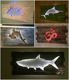 several different types of fish mounted on wooden planks with led lights in the shape of letters