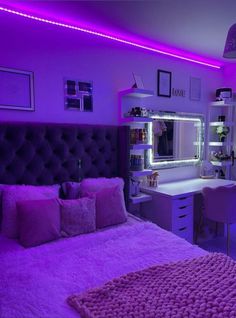 a bedroom with purple lighting in the room