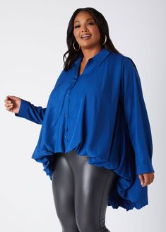 Elevate your wardrobe with our chic collared shirt, featuring chic balloon-effect hi-low hemline. This refined piece combines timeless elegance with modern flair, thanks to its sophisticated silhouette and button-fastening sleeve cuffs. The exaggerated hi-low hemline adds a touch of drama, while the crisp cotton-blend fabric ensures a luxurious feel. With button fastenings through the front, this shirt is perfect for those who appreciate effortless sophistication and standout style. Plus Size Tops For Women, Professional Photo Shoot, Blouse Plus Size, Poplin Top, Ashley Stewart, Shirt Store, Plus Size Top, Faux Leather Leggings, Collared Shirt